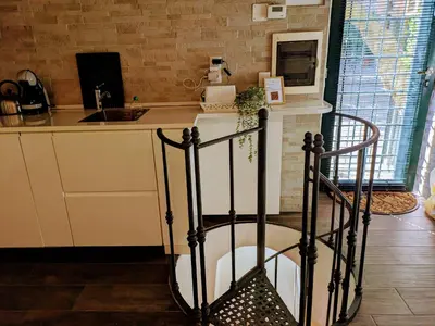 a kitchen with a counter with a sink and a counter at Trastevere's Nest in Rome