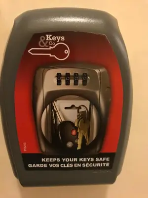a close up of a electronic device with a key sign at Emilios home Triple room in our cozy and comfortable establishment in Rome