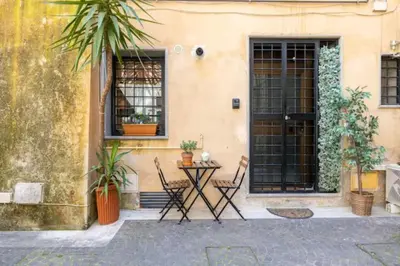 a dining room with purple chairs and a table at Relax Campo de' Fiori in Rome