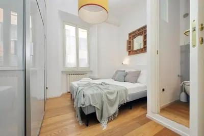 a bedroom with a bed and a table in it at Segneri Viale Trastevere in Rome