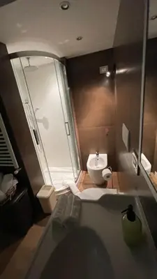 a bathroom with a tub and a toilet and a sink at Frank Host Roma Lux , Metro A a 50 m, simple check-in con codice a qualsiasi orario in Rome