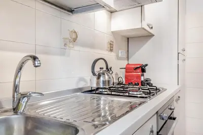 a kitchen with a sink and a stove at APARTMENT IN TRASTEVERE in Rome