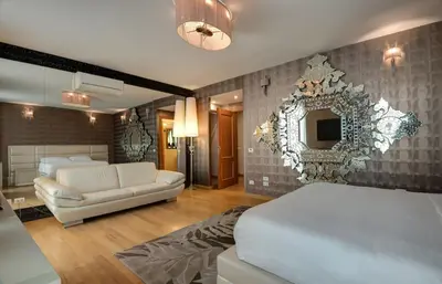 a bedroom with a bed and a couch and a mirror at Penthouse Suite Rome - Private Suites in Rome