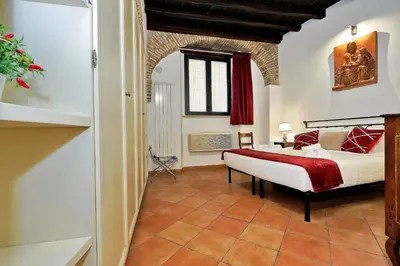 a bedroom with a bed in a room at luxury home trastevere in Rome