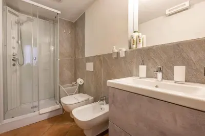 a bathroom with a sink and a toilet and a shower at Happy Trastevere in Rome in Rome