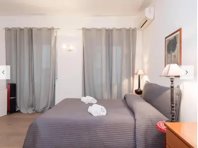 a bedroom with a bed with two towels on it at Natale del Grande flat in Rome