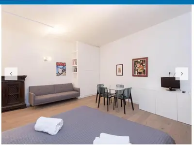 a living room with a couch and a table at Natale del Grande flat in Rome