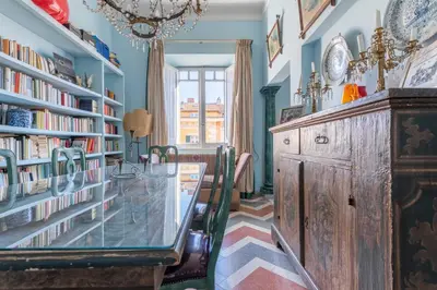 a hallway with blue walls and a white door at Residenza Prati - ZEN24 in Rome