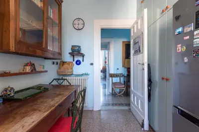 a living room with a couch and a painting on the wall at Residenza Prati - ZEN24 in Rome