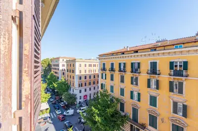 a bedroom with a bed and a dresser and a window at Residenza Prati - ZEN24 in Rome