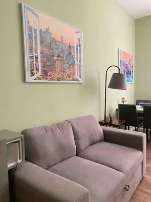 a living room with a couch and a table at Carpegna42 in Rome