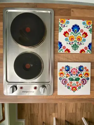 a toaster oven sitting on top of a shelf with paintings at Carpegna42 in Rome