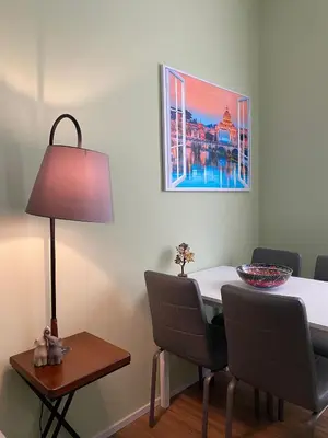 a dining room with a table and a lamp at Carpegna42 in Rome