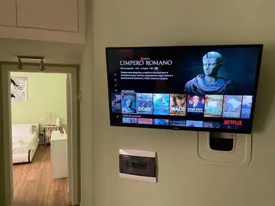 a flat screen tv hanging on a wall at Carpegna42 in Rome