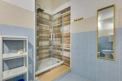 a bathroom with a shower and a toilet at Gladiator's House in Rome
