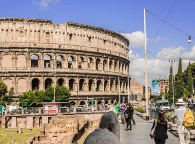 people walking in front of the coliseum at Gladiator's House in Rome