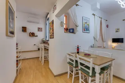 a kitchen and dining room with a table and chairs at Gladiator's House in Rome