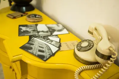 a phone sitting on top of a yellow table at I Colori di Nini Vacanza a Trastevere in Rome