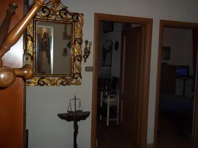 a mirror on the wall of a room with a table at Il Pretoriano in Rome