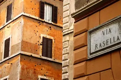 a building with a sign on the side of it at Trevi Little Palace #2 in Rome