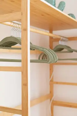 a wooden shelving unit with wooden shelves at Cactus2023 in Rome