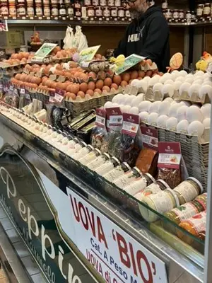 a store display of eggs and other food items at Cactus2023 in Rome