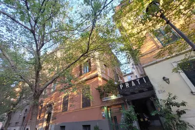 a building with a sign on the side of it at Beautiful apartment with amazing Rooftop&Jacuzzi in Rome
