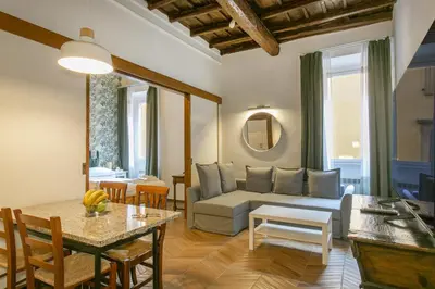 a living room with a couch and a table at Trevi Little Palace #4 in Rome
