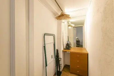 a hallway with a dresser and a mirror at Trevi Little Palace #4 in Rome