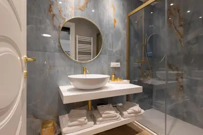a bathroom with a sink and a mirror at RomeInSuite in Rome