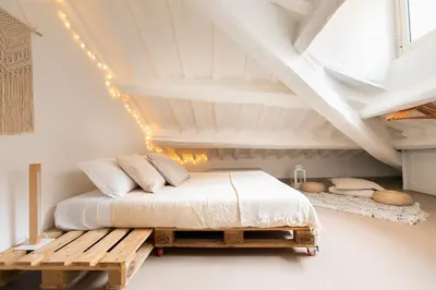 a bedroom with a bed and a wooden bench at Rooftop Colosseum in Rome