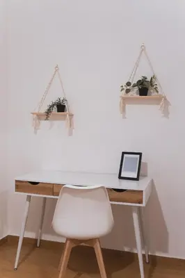 a desk with a white chair and two plants at Marconi 31 Rome Holiday House - Rome Vacation M&D in Rome