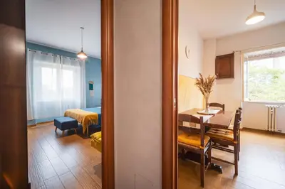 a room with a table and a dining room at Marconi 31 Rome Holiday House - Rome Vacation M&D in Rome