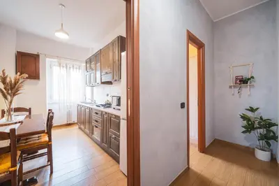 a kitchen with a table and a dining room at Marconi 31 Rome Holiday House - Rome Vacation M&D in Rome