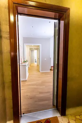 an open doorway to a room with a hallway at Noh collection 3BDR apartment- Trastevere Area in Rome
