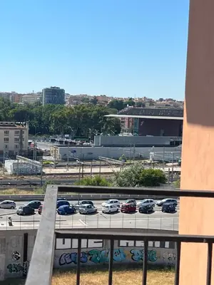 a view of a parking lot with cars parked at Stazione Tiburtina - Camesena Apartment in Rome