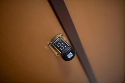 a close up of a door with a remote control on it at [Centro Storico-5min Vaticano] Domus in Rome