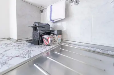 a kitchen counter with a sink and a mixer at [Centro Storico-5min Vaticano] Domus in Rome