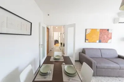 a living room with a table and a couch at [Centro Storico-5min Vaticano] Domus in Rome
