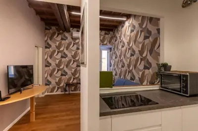 a kitchen with a microwave and a counter top at Roma Centro Storico Luxury - Via del Corso in Rome