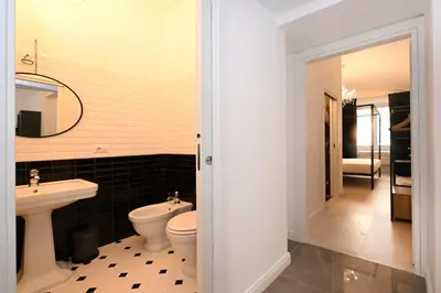 a bathroom with a toilet and a sink at VATICAN DESIGN APARTMENTS in Rome