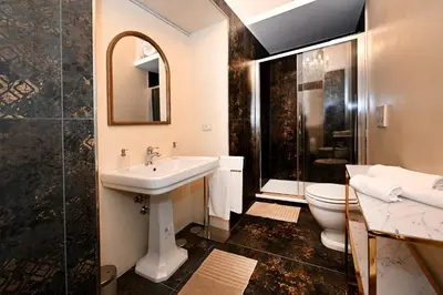 a bathroom with a sink and a toilet at VATICAN DESIGN APARTMENTS in Rome