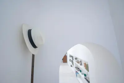 a room with a wall mounted speaker in a hallway at Via Giulia Charming Atelier apartment in Rome