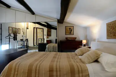 a bedroom with a large bed in a room at Appartamento Coronari in Rome