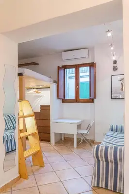 a room with a bunk bed and a desk at EasyTopStay - Monti Studio Apartment in Rome