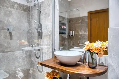a bathroom with a sink and a shower at Di Martino Residence in Rome