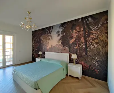 a bedroom with a bed and a wall mural at Oasi Urbana San Paolo in Rome