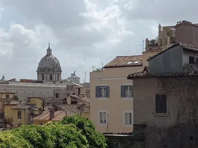 a view of a city with a cathedral in the background at Casa Campo de' Fiori in Rome