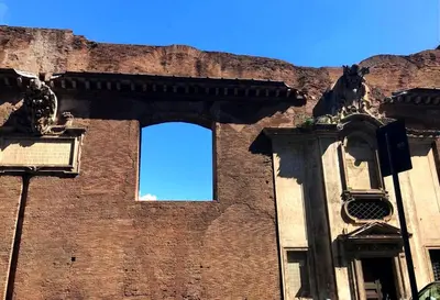 a brick building with a window on the side of it at White Suite in Rome in Rome