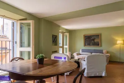 a living room with a table and a couch at EasyTopStay - Piazza Venezia Charming & Bright Apt in Rome